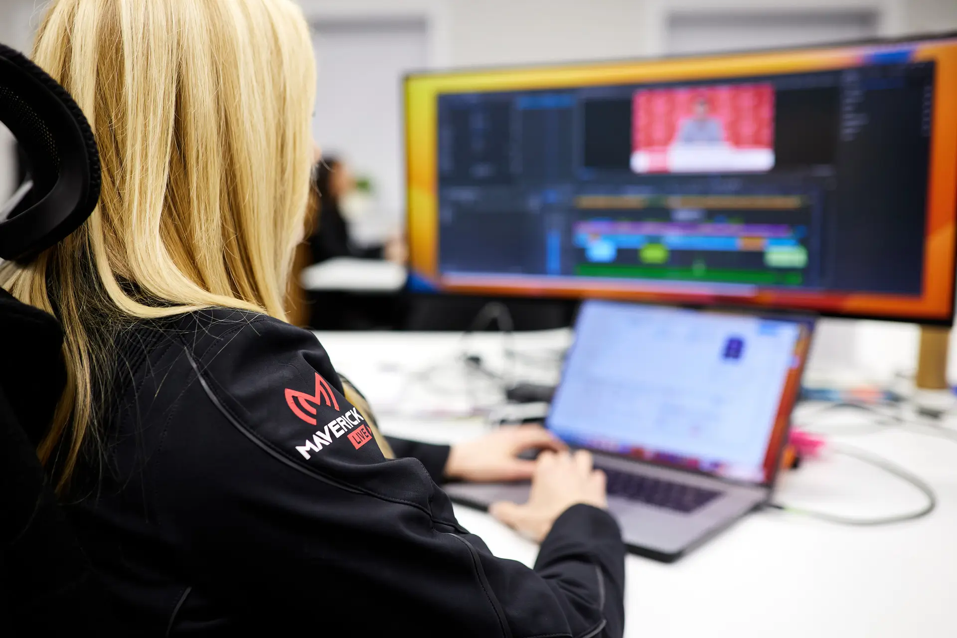 Video editor working at desk